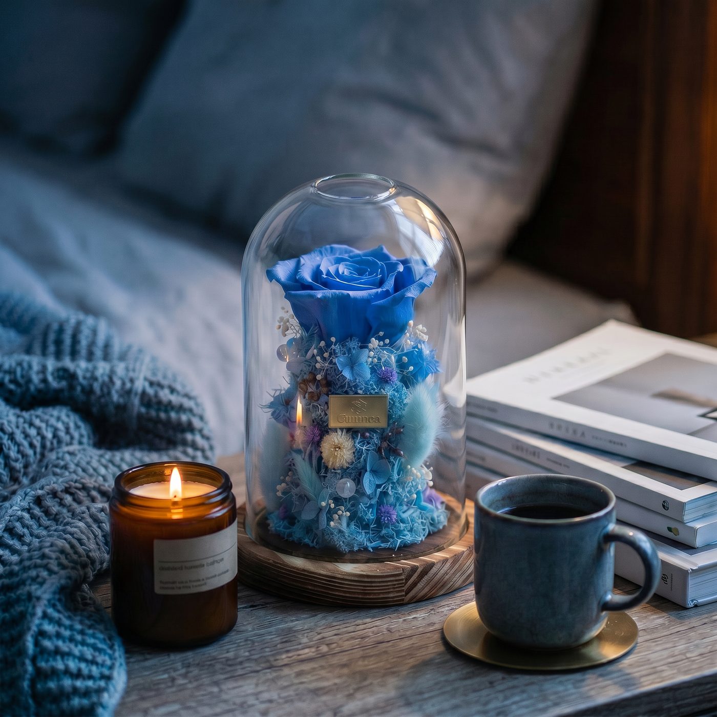 Blue preserved rose under a glass dome on a ceramic base view 2